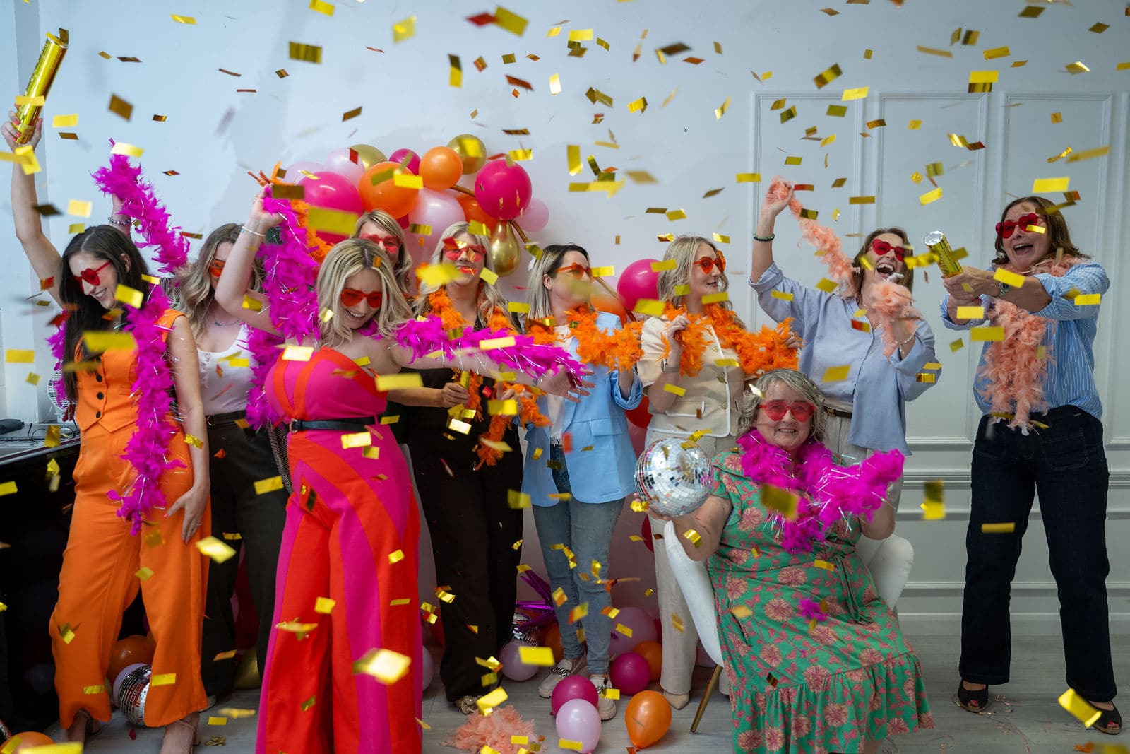 Women business owners celebrating with confetti at the EMpowered Media studio