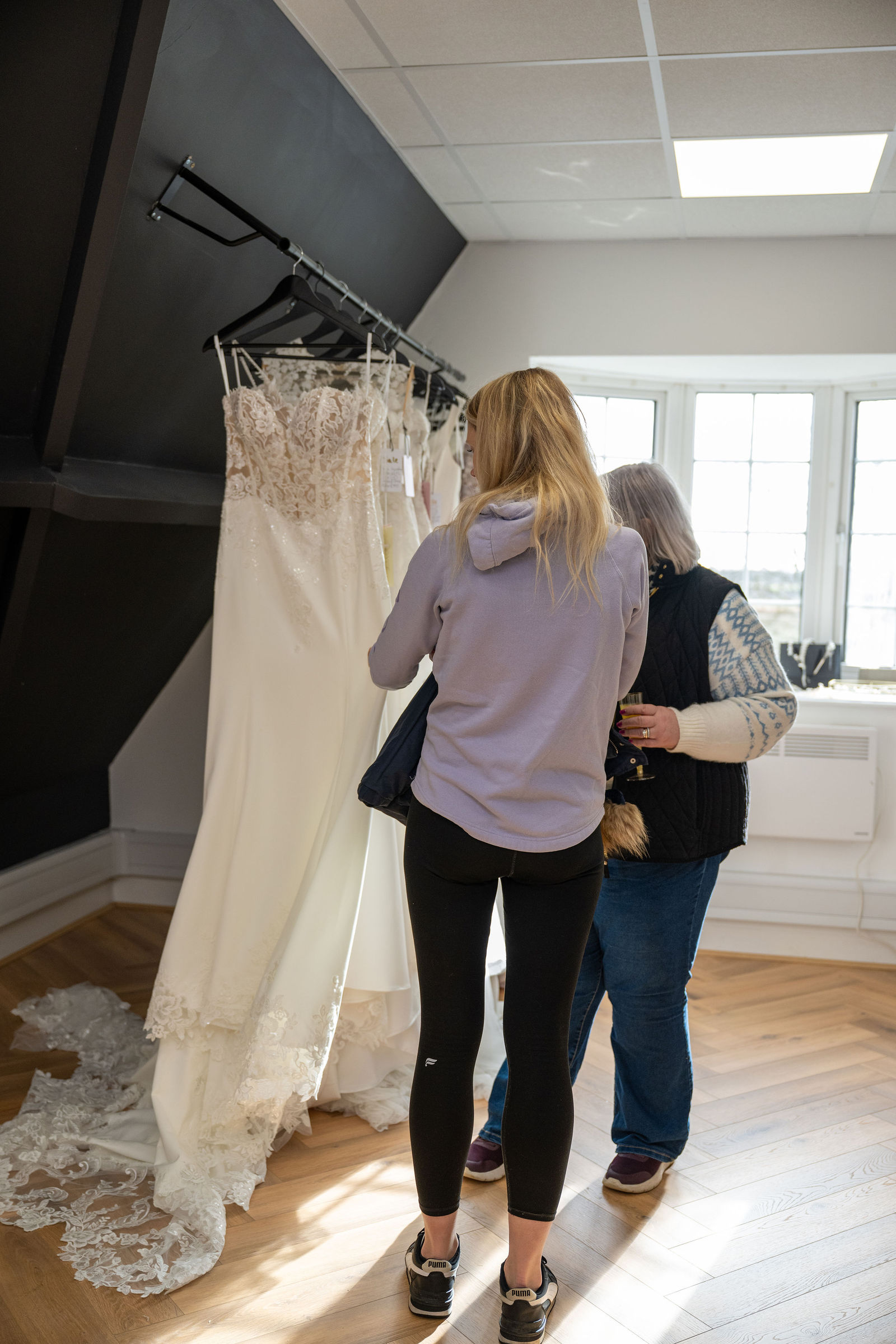 Yorkshire Bridal Boutique, York: bride browsing gowns (photography by EMpowered Media)